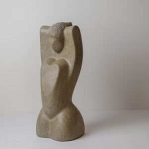 Limestone sculpture "Unfurling Goddess" carved in Indiana limestone in 2016. Three quarter view (left).